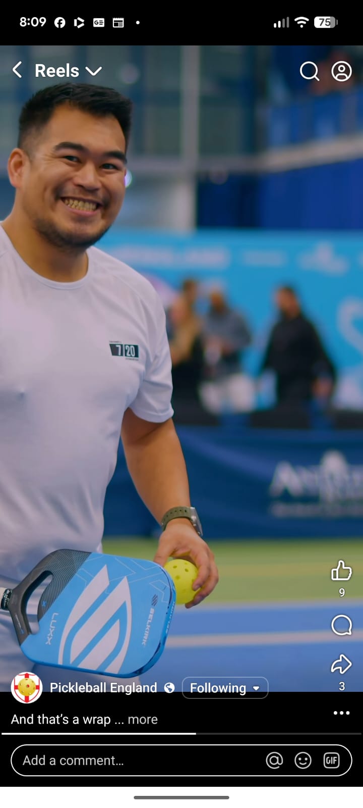 Two club players sharing a laugh and a paddle tap between points.